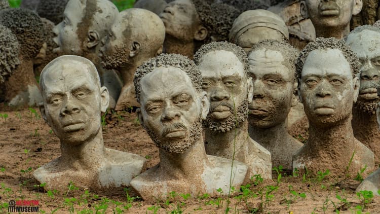 Place to See - Heads extending from the ground