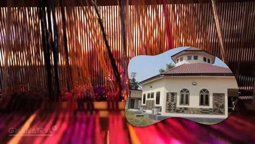 Place to See - Interior of Bonwire Kente Museum showcasing vibrant Kente cloth displays and traditional weaving looms.